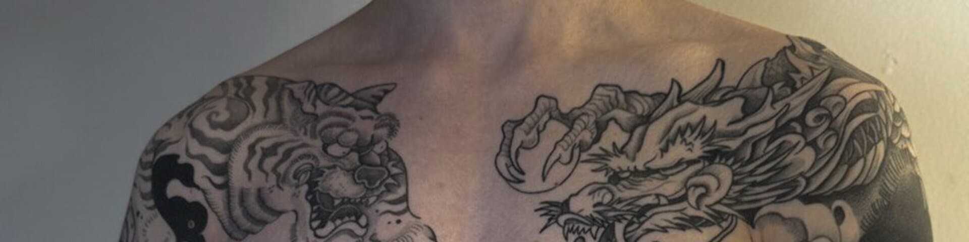 Full-body blackwork tattoo by Kisha